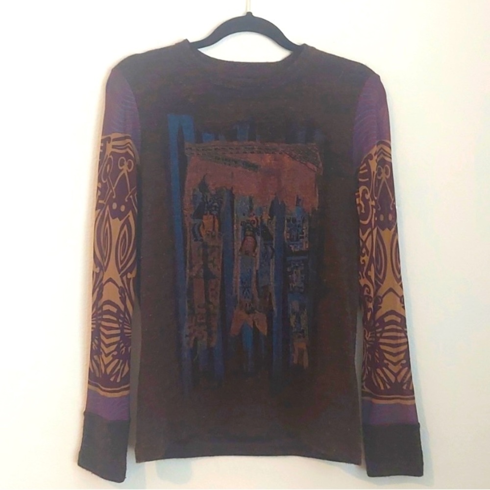 Save the Queen Man copper sweater.  The size is large but fits medium or small.
